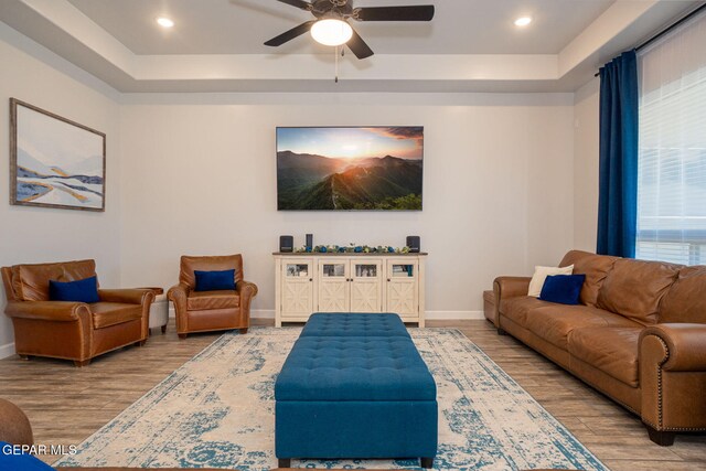 13436 Emerald Crystal Dr, El Paso, TX 79928 - living room featuring wood finished floors, a raised ceiling, baseboards, and recessed lighting