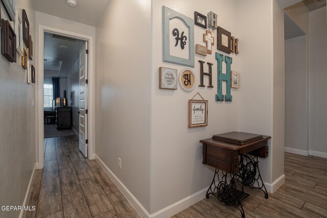 13436 Emerald Crystal Dr, El Paso, TX 79928 - corridor featuring dark wood-style flooring and baseboards