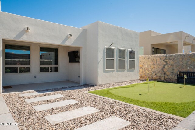 13436 Emerald Crystal Dr, El Paso, TX 79928 - back of property with a putting area, a patio area, and stucco siding