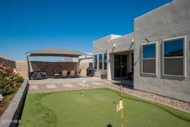 13436 Emerald Crystal Dr, El Paso, TX 79928 - view of yard featuring an area to practice putting and a patio area