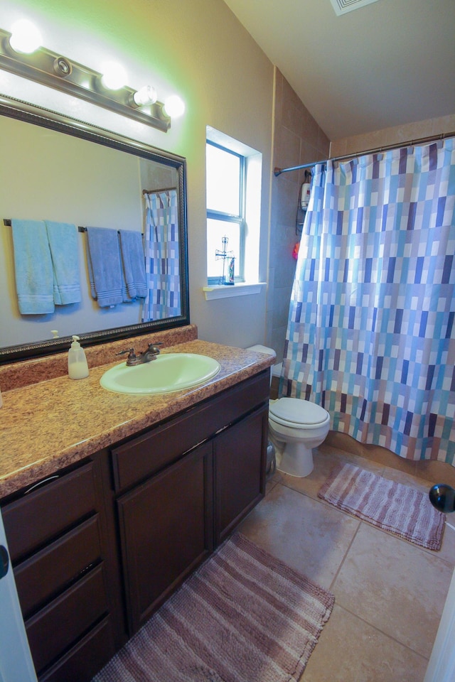 14244 Trigger Rock Ln, El Paso, TX 79938 - bathroom featuring vanity, a shower with shower curtain, toilet, lofted ceiling, and tile patterned floors