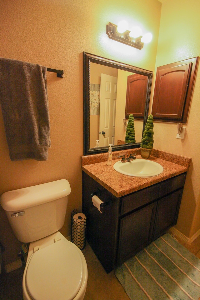 14244 Trigger Rock Ln, El Paso, TX 79938 - half bathroom featuring vanity and toilet