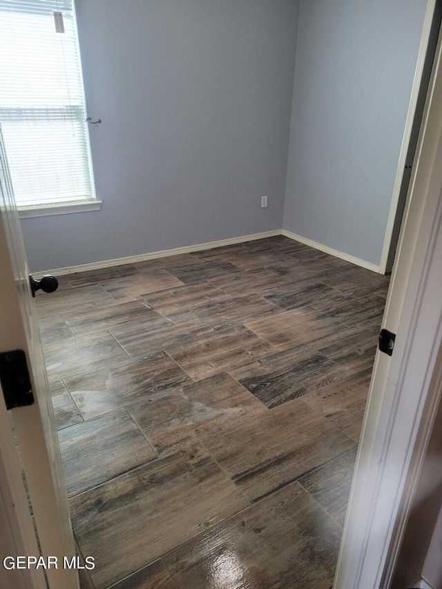 14244 Trigger Rock Ln, El Paso, TX 79938 - spare room with dark wood-style flooring and baseboards