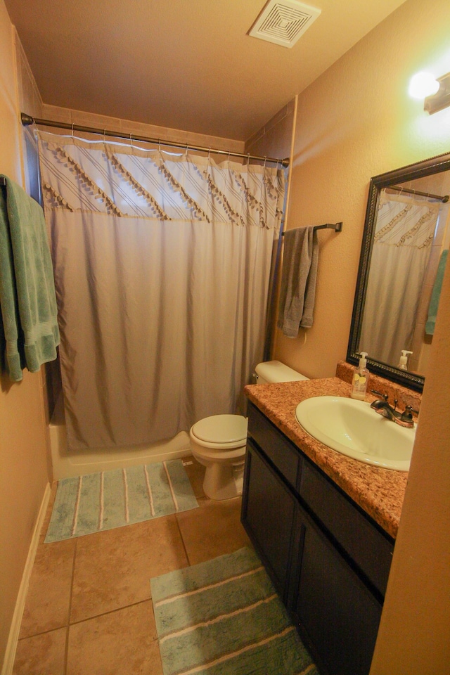 14244 Trigger Rock Ln, El Paso, TX 79938 - bathroom with vanity, toilet, and tile patterned floors