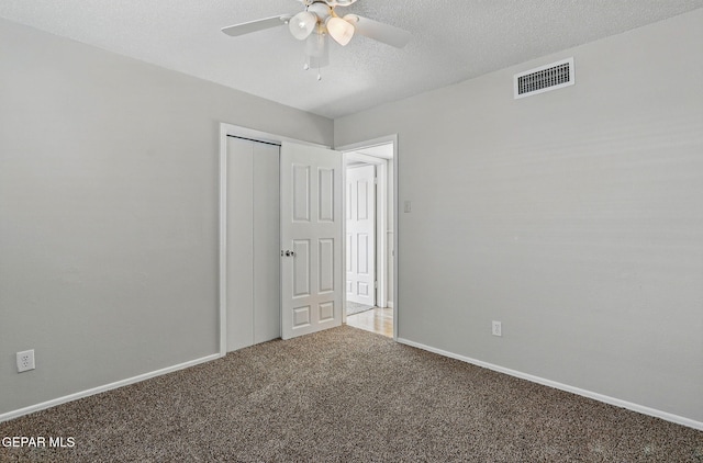 10224 Galahad Way, El Paso, TX 79924 - unfurnished bedroom featuring carpet, baseboards, a closet, and a textured ceiling