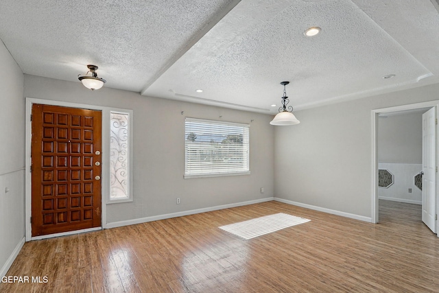 10224 Galahad Way, El Paso, TX 79924 - foyer entrance with a textured ceiling, wood finished floors, baseboards, and recessed lighting