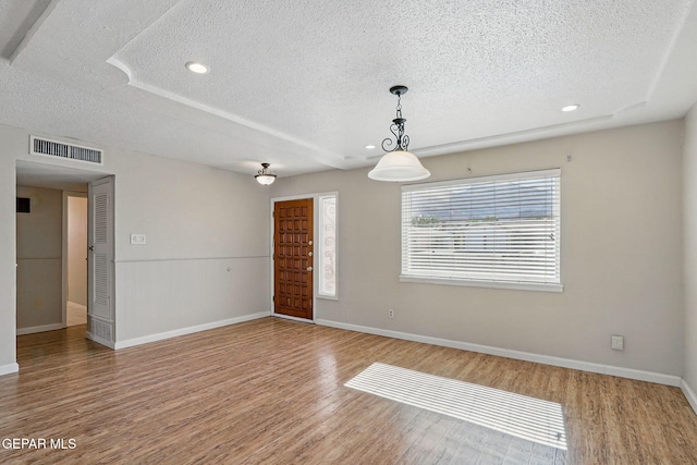 10224 Galahad Way, El Paso, TX 79924 - unfurnished room featuring a textured ceiling, wood finished floors, baseboards, and recessed lighting