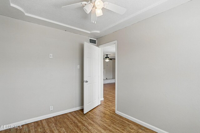10224 Galahad Way, El Paso, TX 79924 - spare room with ceiling fan, a textured ceiling, baseboards, and wood finished floors