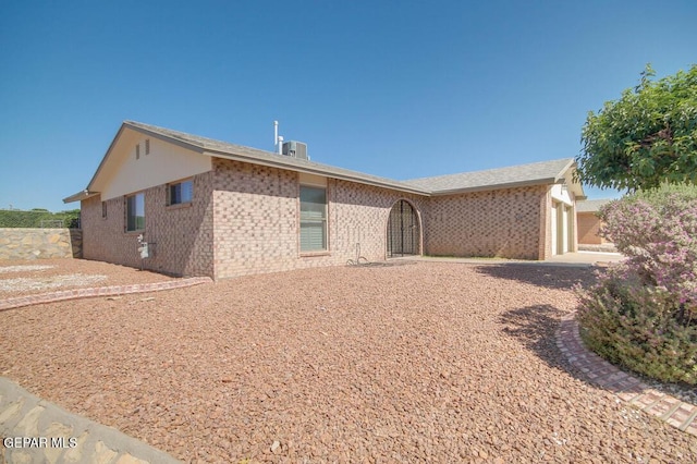1701 Paul Moran Pl, El Paso, TX 79936 - rear view of house with a garage and brick siding