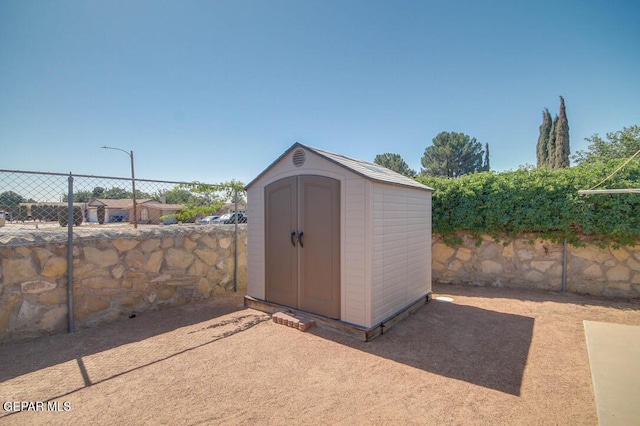 1701 Paul Moran Pl, El Paso, TX 79936 - view of shed with a fenced backyard