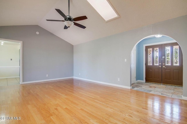 1701 Paul Moran Pl, El Paso, TX 79936 - foyer entrance featuring arched walkways, wood finished floors, vaulted ceiling, ceiling fan, and baseboards