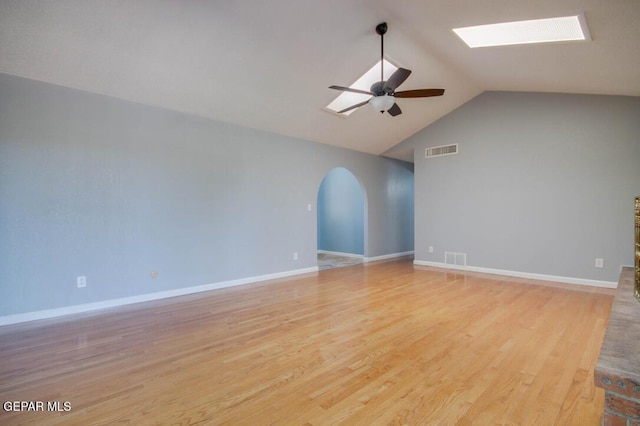 1701 Paul Moran Pl, El Paso, TX 79936 - spare room featuring ceiling fan, a skylight, light wood-type flooring, arched walkways, and high vaulted ceiling