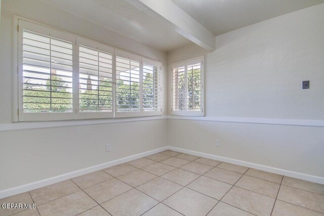 1701 Paul Moran Pl, El Paso, TX 79936 - empty room with light tile patterned flooring and baseboards