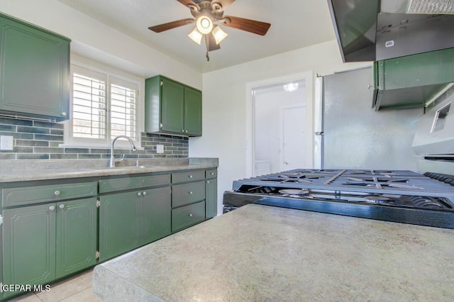 1701 Paul Moran Pl, El Paso, TX 79936 - kitchen featuring green cabinetry, ceiling fan, decorative backsplash, light countertops, and a sink