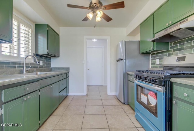 1701 Paul Moran Pl, El Paso, TX 79936 - kitchen with appliances with stainless steel finishes, green cabinetry, under cabinet range hood, a sink, and a ceiling fan