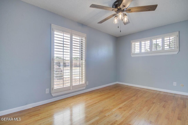 1701 Paul Moran Pl, El Paso, TX 79936 - empty room with wood finished floors, baseboards, and ceiling fan
