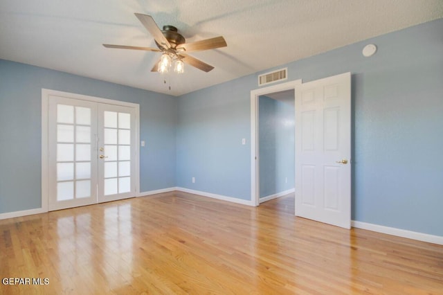 1701 Paul Moran Pl, El Paso, TX 79936 - unfurnished room featuring french doors, light wood-style flooring, a ceiling fan, and baseboards