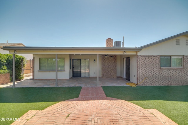 1701 Paul Moran Pl, El Paso, TX 79936 - rear view of property with a chimney, a patio, a ceiling fan, and central AC