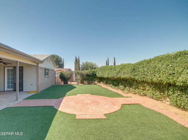 1701 Paul Moran Pl, El Paso, TX 79936 - view of yard featuring ceiling fan and a patio area