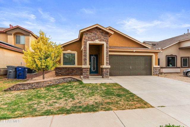14196 Greg Allen, El Paso, TX 79938 - view of front facade featuring stone siding, stucco siding, a garage, and driveway