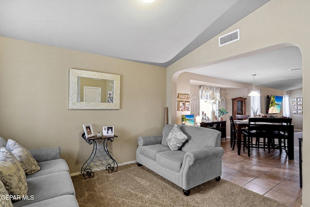 14196 Greg Allen, El Paso, TX 79938 - living room featuring arched walkways, lofted ceiling, baseboards, and a chandelier