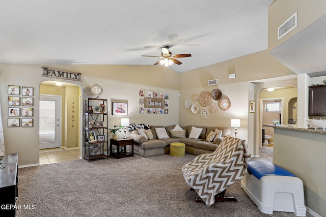 14196 Greg Allen, El Paso, TX 79938 - living room with arched walkways, ceiling fan, light colored carpet, lofted ceiling, and baseboards