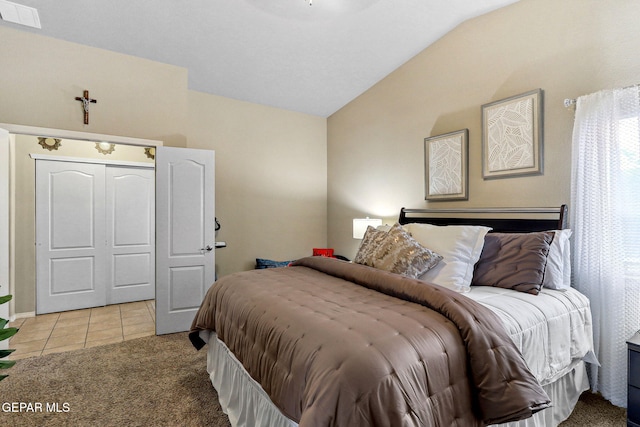 14196 Greg Allen, El Paso, TX 79938 - bedroom featuring vaulted ceiling, light tile patterned floors, and light carpet