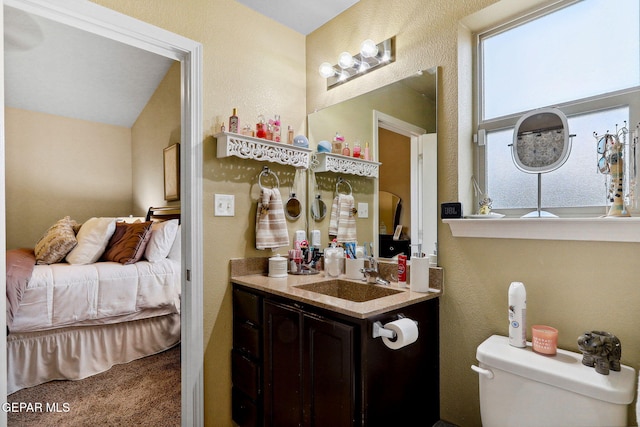 14196 Greg Allen, El Paso, TX 79938 - bathroom with vanity, connected bathroom, toilet, and a textured wall