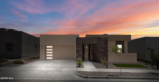 832 Acton St, Horizon City, TX 79928 - contemporary home featuring driveway, an attached garage, and stucco siding