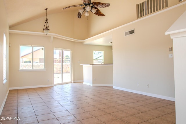 11896 Crimson Sky Dr, El Paso, TX 79936 - spare room with ceiling fan, high vaulted ceiling, tile patterned flooring, and baseboards