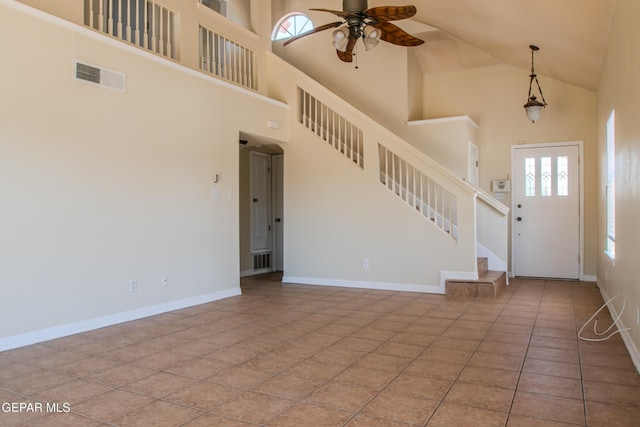 11896 Crimson Sky Dr, El Paso, TX 79936 - tiled foyer entrance featuring a ceiling fan, high vaulted ceiling, plenty of natural light, stairway, and baseboards