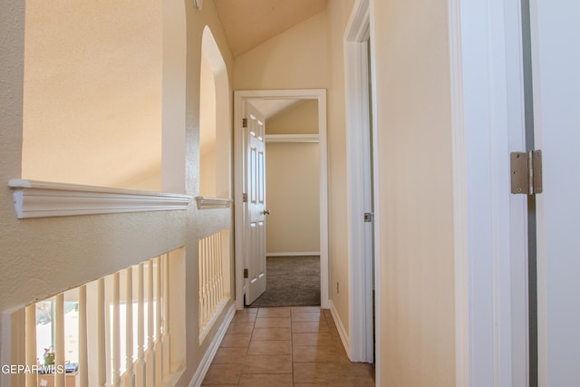 11896 Crimson Sky Dr, El Paso, TX 79936 - corridor featuring tile patterned flooring, vaulted ceiling, and baseboards