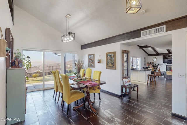 3104 Pagosa Ct, El Paso, TX 79904 - dining area with baseboards and high vaulted ceiling