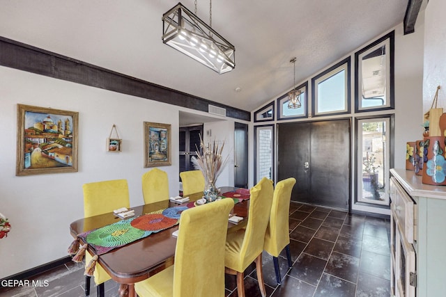 3104 Pagosa Ct, El Paso, TX 79904 - dining space with vaulted ceiling and dark tile patterned flooring