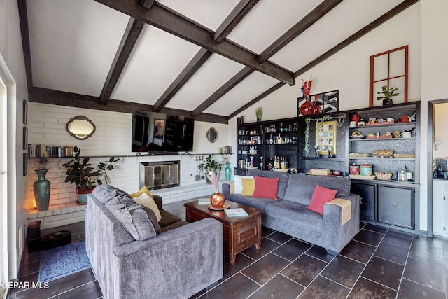 3104 Pagosa Ct, El Paso, TX 79904 - living area with a bar, a brick fireplace, and dark tile patterned flooring