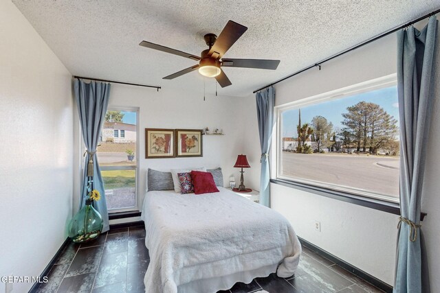 3104 Pagosa Ct, El Paso, TX 79904 - bedroom featuring a textured ceiling, a ceiling fan, and baseboards