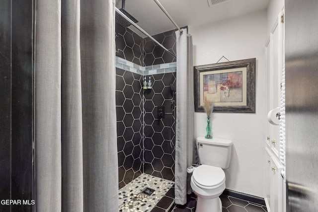3104 Pagosa Ct, El Paso, TX 79904 - full bathroom featuring toilet, a stall shower, and tile patterned flooring