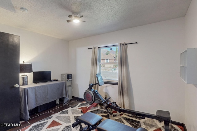 3104 Pagosa Ct, El Paso, TX 79904 - exercise room with ceiling fan, a textured ceiling, and baseboards