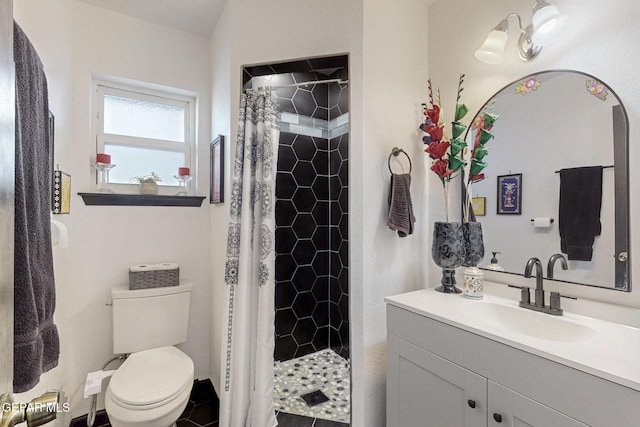 3104 Pagosa Ct, El Paso, TX 79904 - full bathroom featuring vanity, a shower stall, and toilet