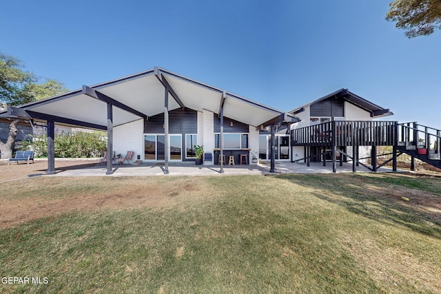 3104 Pagosa Ct, El Paso, TX 79904 - rear view of house with a lawn, a patio area, and stairway