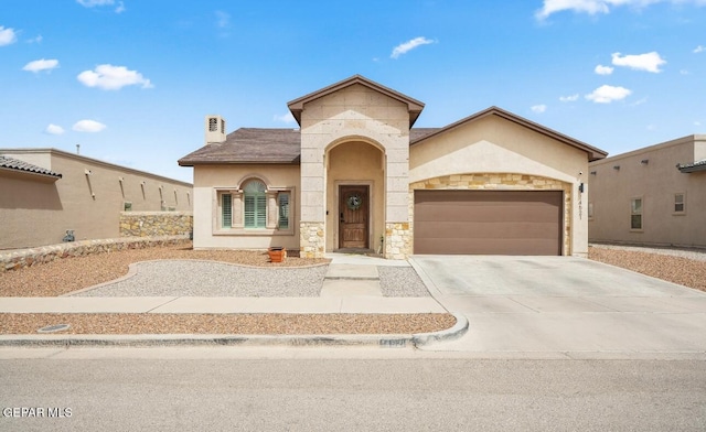 14521 Petralia Ave, El Paso, TX 79938 - view of front facade with stone siding, an attached garage, concrete driveway, stucco siding, and a chimney