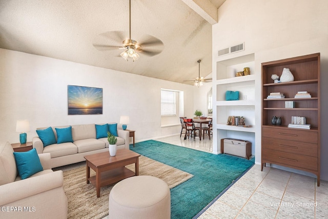 12044 Banner Crest Dr, El Paso, TX 79936 - living area featuring a ceiling fan, a textured ceiling, built in shelves, light tile patterned floors, and high vaulted ceiling