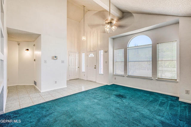 12044 Banner Crest Dr, El Paso, TX 79936 - carpeted foyer with a ceiling fan, beam ceiling, tile patterned floors, high vaulted ceiling, and baseboards