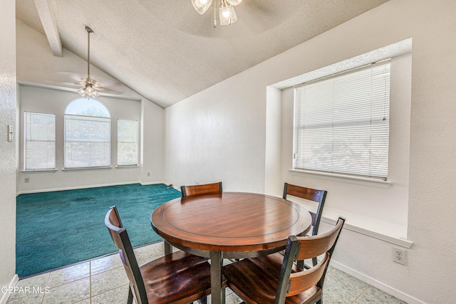 12044 Banner Crest Dr, El Paso, TX 79936 - tiled dining area with ceiling fan, vaulted ceiling, a textured ceiling, baseboards, and carpet flooring