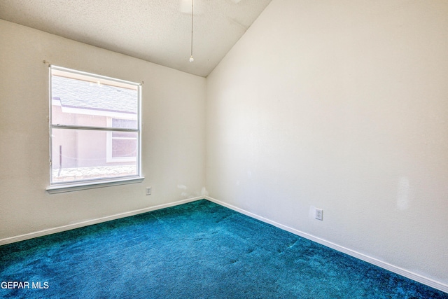 12044 Banner Crest Dr, El Paso, TX 79936 - unfurnished room with dark colored carpet, baseboards, and vaulted ceiling