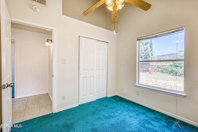 12044 Banner Crest Dr, El Paso, TX 79936 - unfurnished bedroom featuring carpet flooring, a closet, a ceiling fan, and baseboards