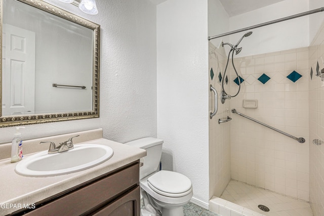 12044 Banner Crest Dr, El Paso, TX 79936 - full bath with toilet, a tile shower, vanity, and a textured wall