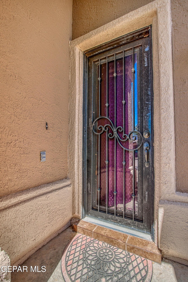 11352 Bullseye St, El Paso, TX 79934 - doorway to property featuring stucco siding
