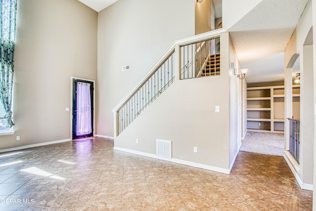 11352 Bullseye St, El Paso, TX 79934 - entryway featuring a high ceiling, baseboards, and arched walkways