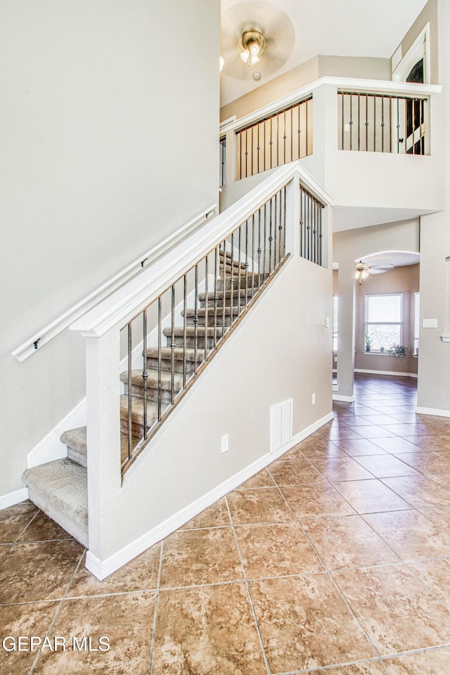 11352 Bullseye St, El Paso, TX 79934 - staircase with ceiling fan, tile patterned flooring, and baseboards